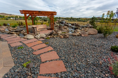 Flagstone path to a pergola