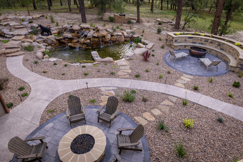Aerial of pond, path and fire-pit circle