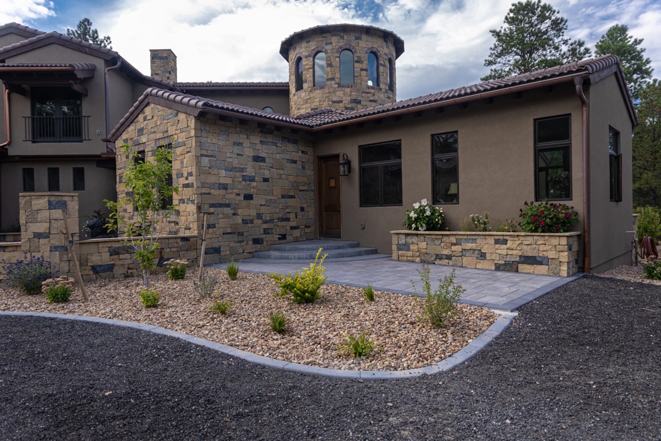 Stone house with a courtyard and dry-climate planting