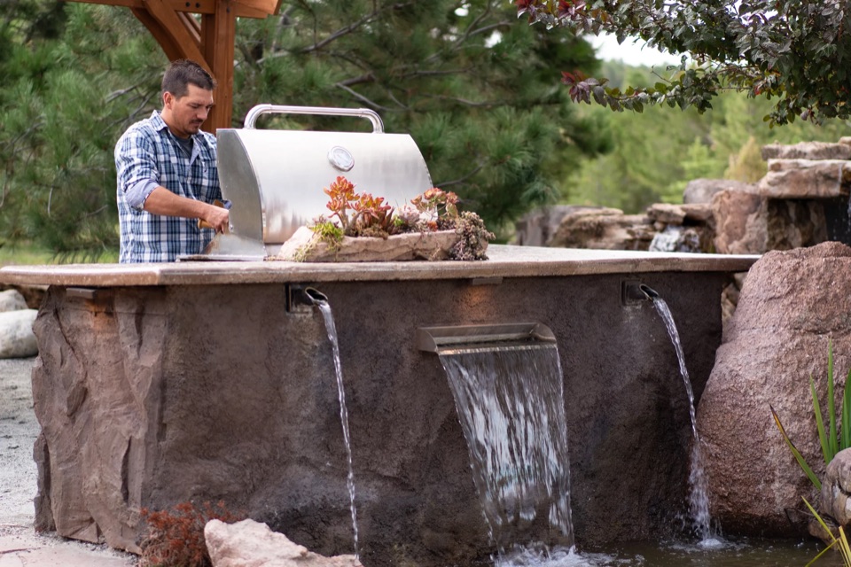 Faux-rock kitchen with chef and waterfall spillway