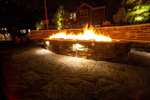 Long rectangular fire pits at night