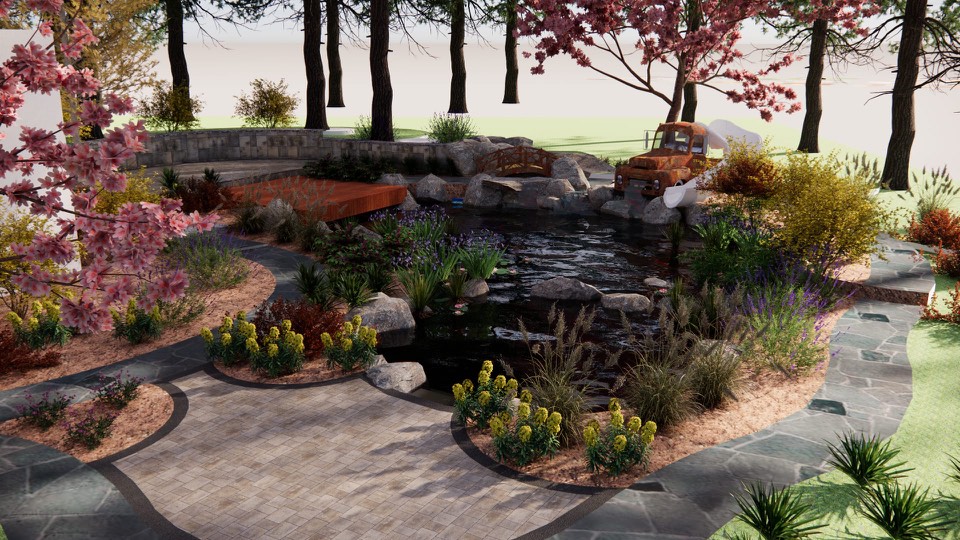 3D design view across a paver patio to the pond, the rusted-truck waterfall and slide, the footbridge and deck under flowering trees