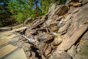 photo of a large natural rock water feature