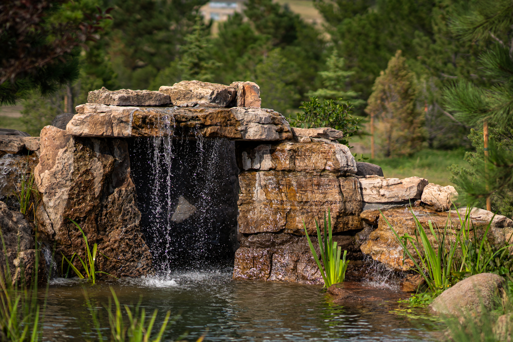 photo of a large faux rock water feature