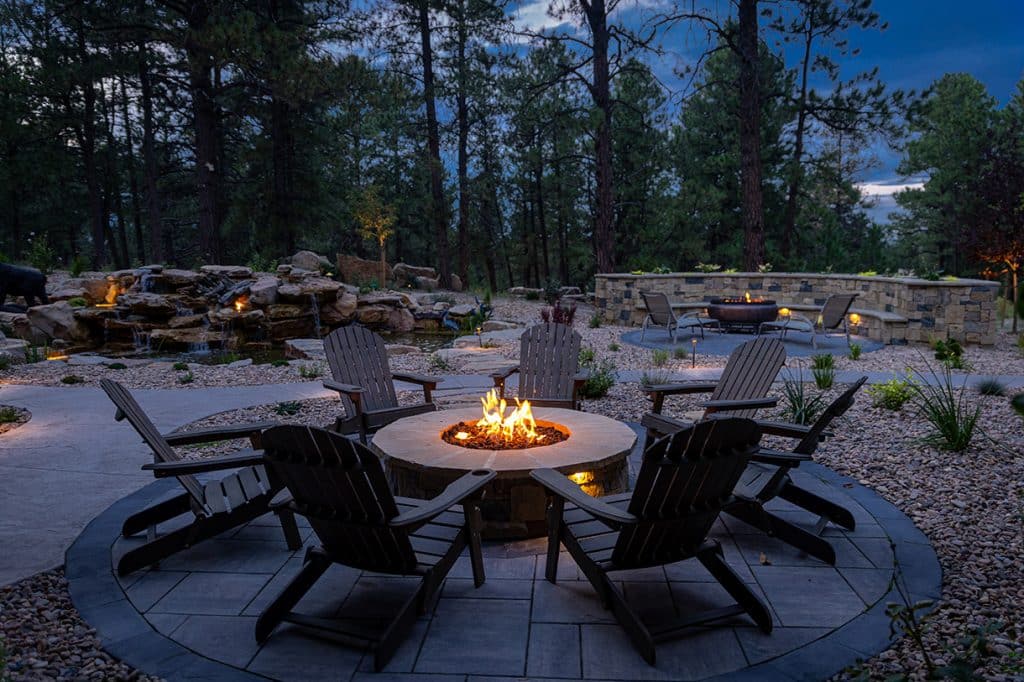 An image of a fire put amid a nicely landscaped outdoor space